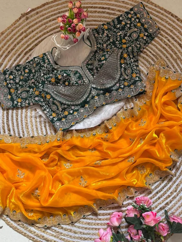 Yellow_Organza_Silk_Saree_With_Embroidered_Blouse_And_Golden_Border