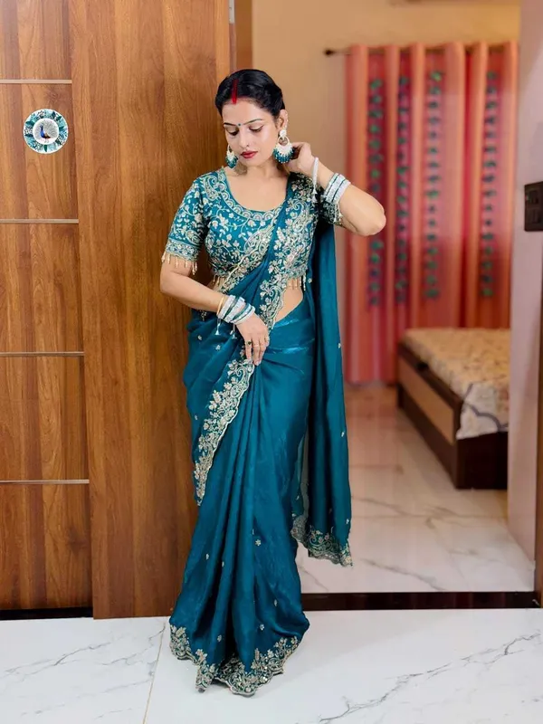 Teal_Blue_Embroidered_Silk_Saree_With_Heavy_Golden_Border_Work