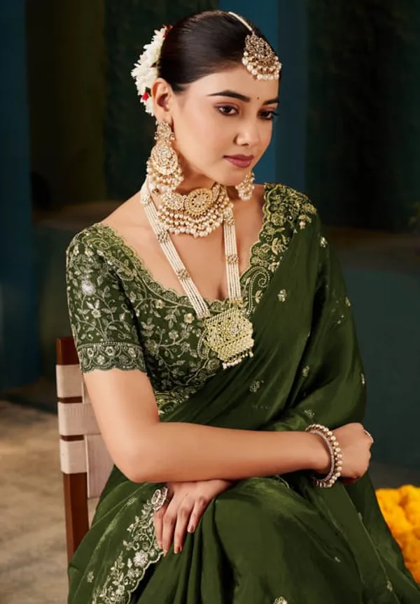 Elegant_Green_Embroidered_Saree_With_Designer_Blouse_And_Traditional_Gold_Jewelry_Set