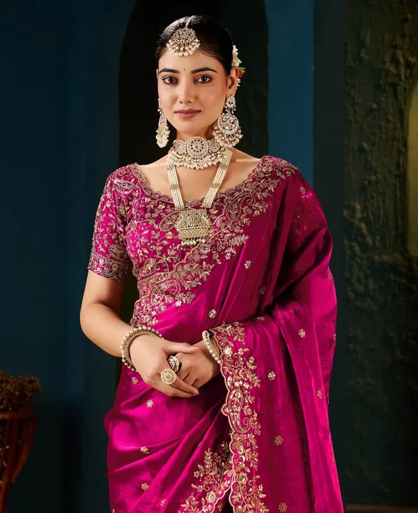 Pink_Embroidered_Silk_Saree_With_Heavy_Blouse_And_Pearl_Necklace