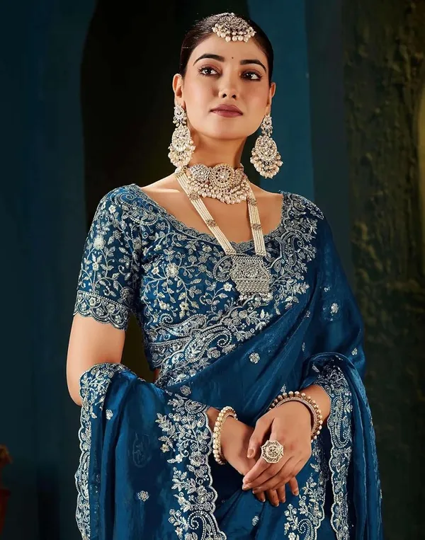 Teal_Blue_Embroidered_Saree_With_Heavy_Embellished_Blouse