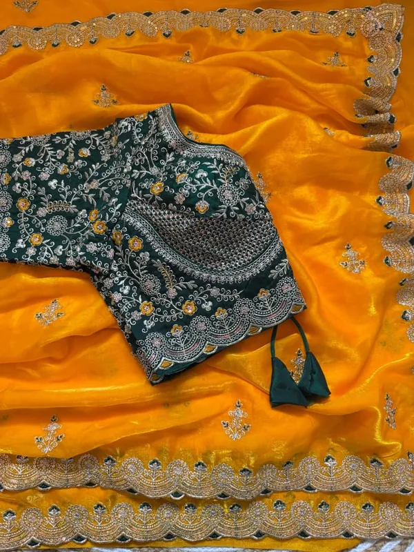 Yellow_Organza_Silk_Saree_With_Embroidered_Blouse_And_Golden_Border
