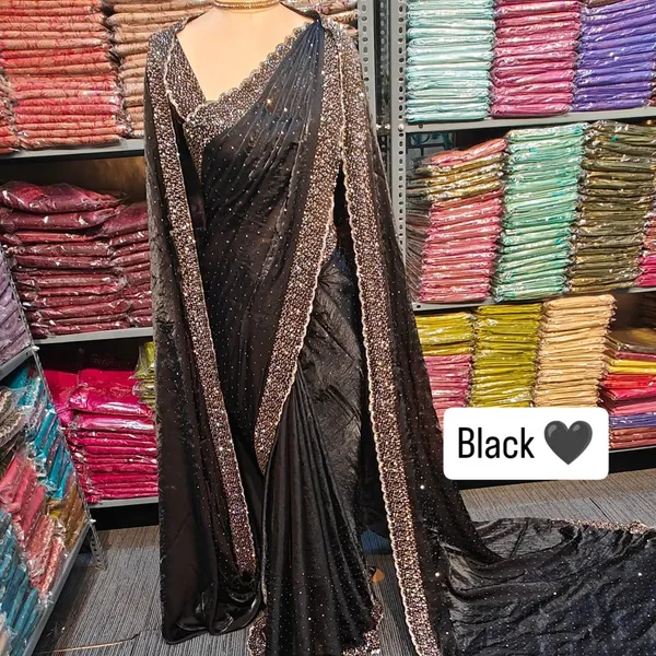 Elegant_Black_Saree_With_Golden_Border_And_Embellished_Blouse