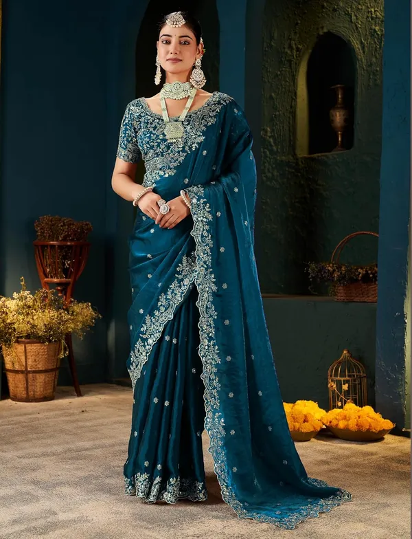 Teal_Blue_Embroidered_Saree_With_Heavy_Embellished_Blouse