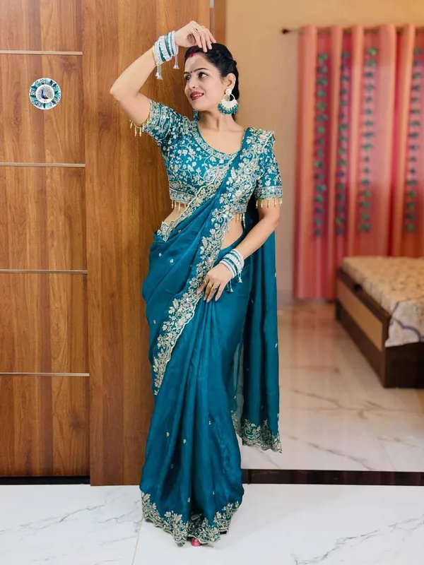 Teal_Blue_Embroidered_Silk_Saree_With_Heavy_Golden_Border_Work
