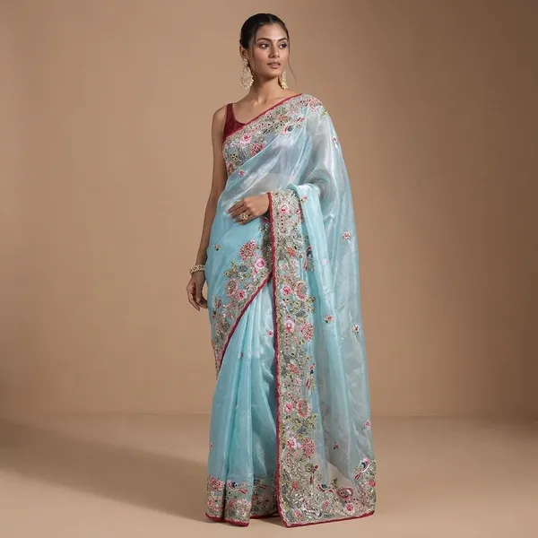 Sky_Blue_Embroidered_Organza_Saree_With_Floral_Border_And_Red_Blouse