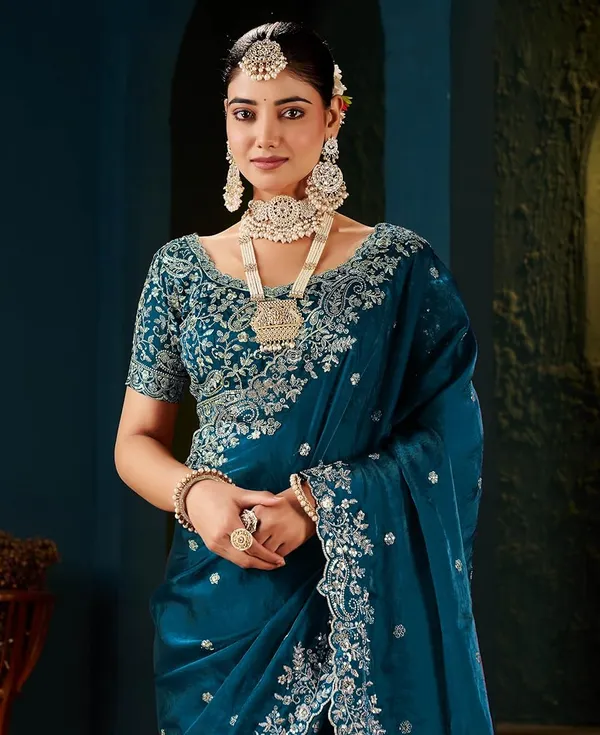 Teal_Blue_Embroidered_Saree_With_Heavy_Embellished_Blouse