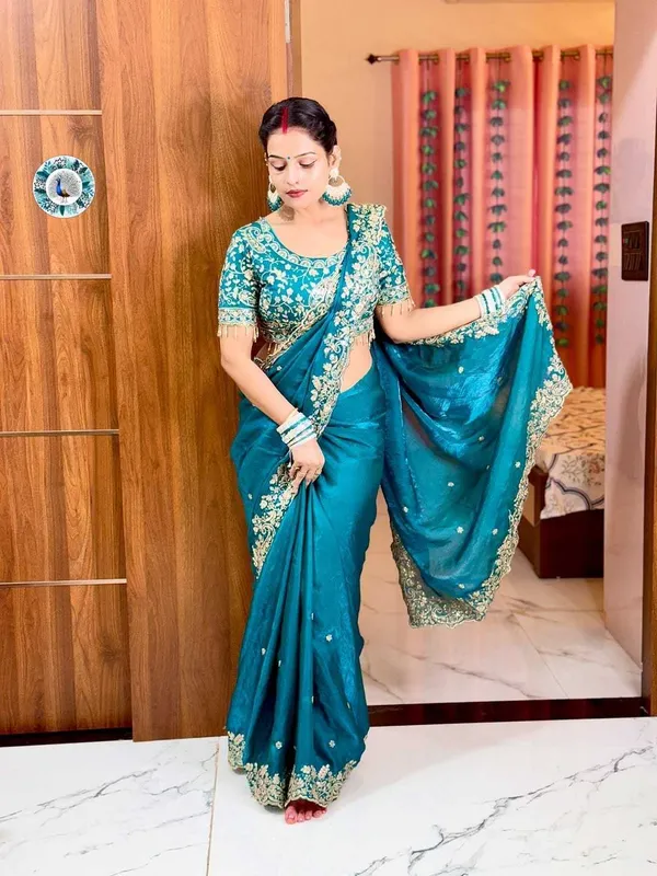 Teal_Blue_Embroidered_Silk_Saree_With_Heavy_Golden_Border_Work