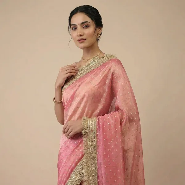 Pink_Georgette_Saree_With_Golden_Zari_Border_And_Pearl_Embellishments