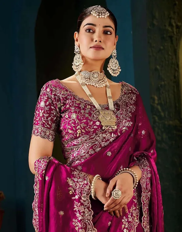 Pink_Embroidered_Silk_Saree_With_Heavy_Blouse_And_Pearl_Necklace