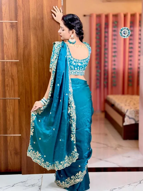 Teal_Blue_Embroidered_Silk_Saree_With_Heavy_Golden_Border_Work
