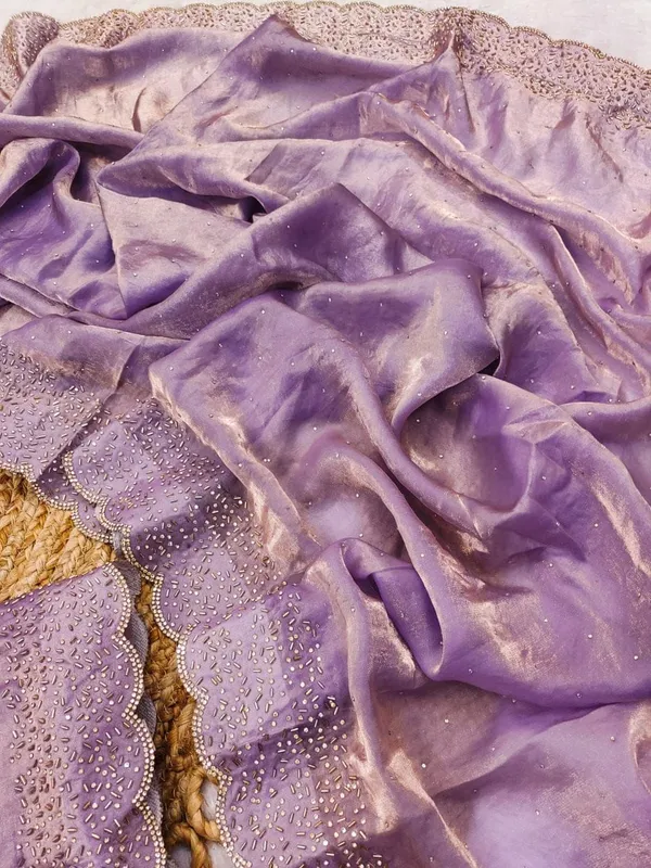 Purple_Embroidered_Net_Saree_With_Lace_Border_And_Blouse_Piece