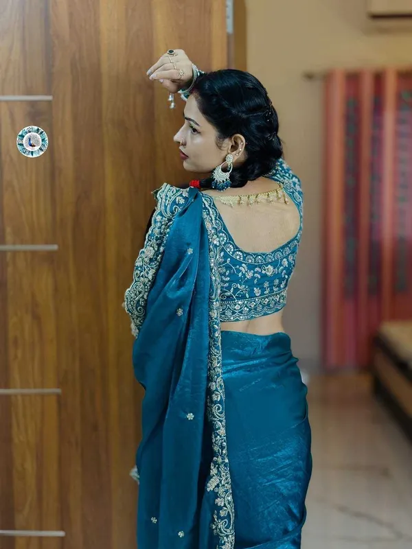 Teal_Blue_Embroidered_Silk_Saree_With_Heavy_Golden_Border_Work