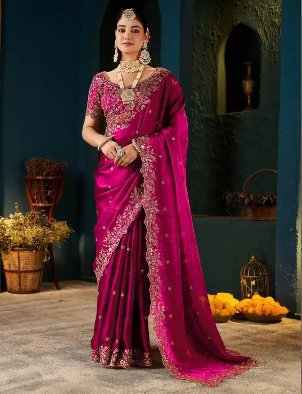 Pink_Embroidered_Silk_Saree_With_Heavy_Blouse_And_Pearl_Necklace