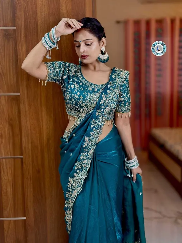 Teal_Blue_Embroidered_Silk_Saree_With_Heavy_Golden_Border_Work