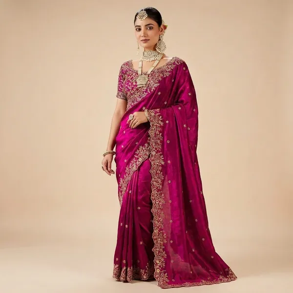Pink_Embroidered_Silk_Saree_With_Heavy_Blouse_And_Pearl_Necklace