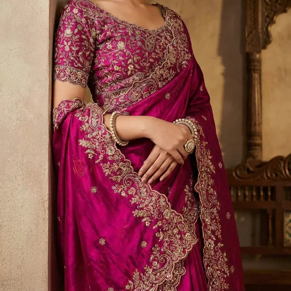 Pink_Embroidered_Silk_Saree_With_Heavy_Blouse_And_Pearl_Necklace