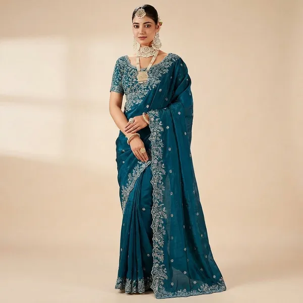 Teal_Blue_Embroidered_Saree_With_Heavy_Embellished_Blouse