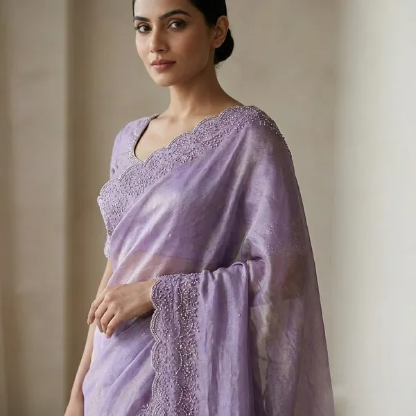 Purple_Embroidered_Net_Saree_With_Lace_Border_And_Blouse_Piece