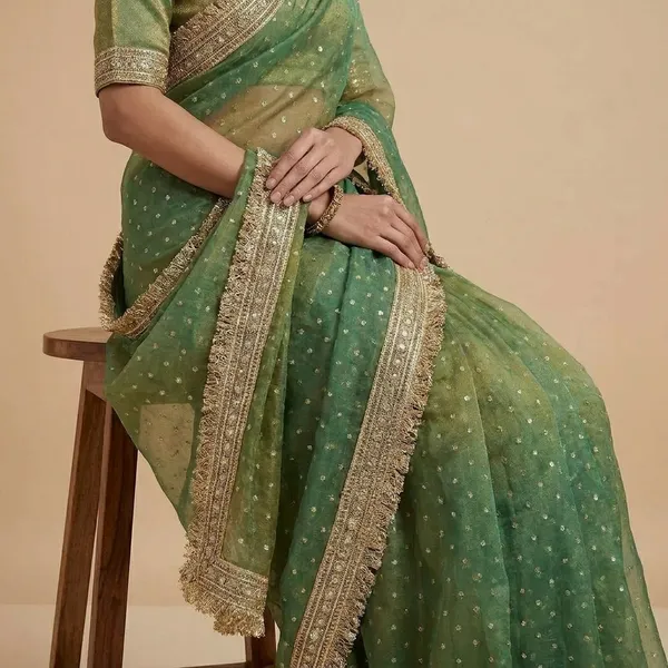 Elegant_Green_Ombre_Embellished_Saree_With_Golden_Lace_Border