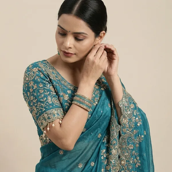 Teal_Blue_Embroidered_Silk_Saree_With_Heavy_Golden_Border_Work