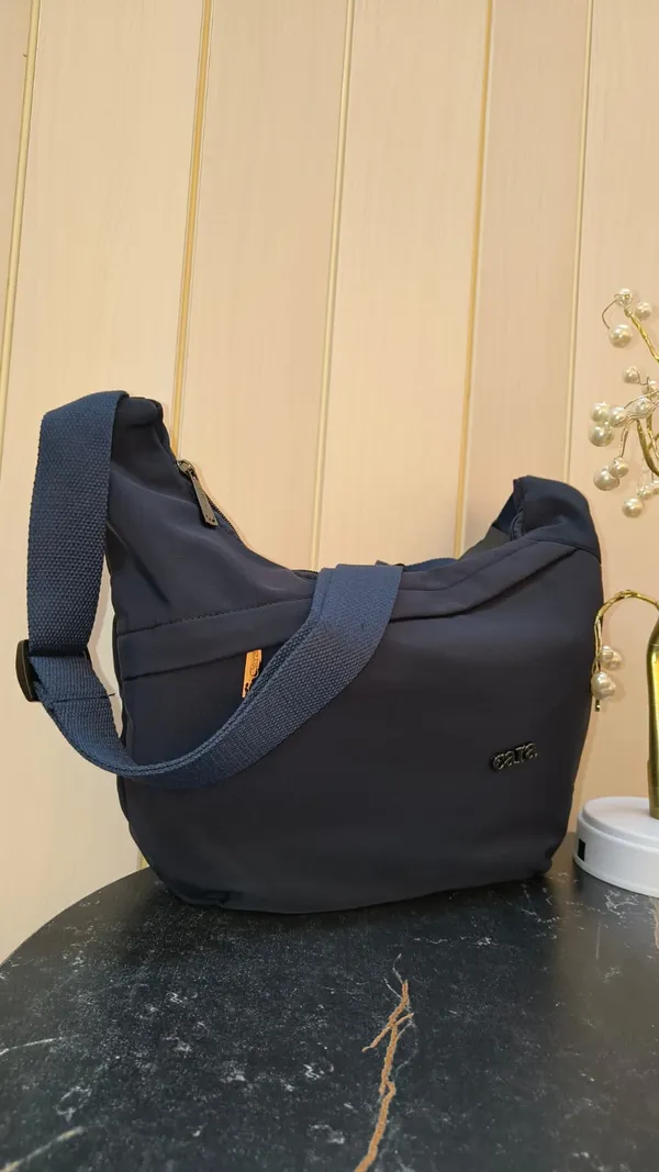 Stylish_Moon_Sling_Bags_Premium_Nylon_Lycra_Imported_Material_super_light_weight_apt_for_college,_office,_travel_or_outings_with_multiple_sturdy_zip_compartments_Deep_Navy_Blue