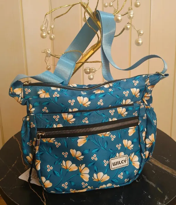 Floral_Sling_bags_for_women_with_multiple_zip_pockets_compact_and_spacious_ideal_for_daily_use,_outings_or_travel_premium_waterproof_material_with_high_quality_zips_(Blue)