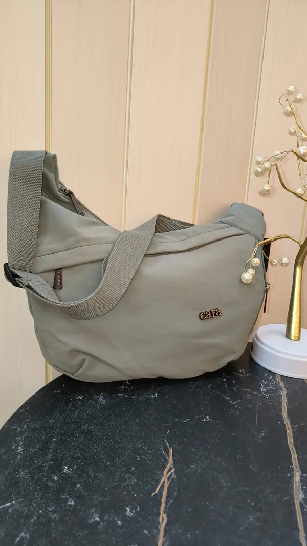 Stylish_Moon_Sling_Bags_Premium_Nylon_Lycra_Imported_Material_super_light_weight_apt_for_college,_office,_travel_or_outings_with_multiple_sturdy_zip_compartments_Cool_Grey
