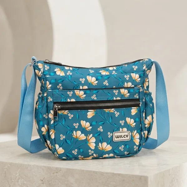 Floral_Sling_bags_for_women_with_multiple_zip_pockets_compact_and_spacious_ideal_for_daily_use,_outings_or_travel_premium_waterproof_material_with_high_quality_zips_(Blue)