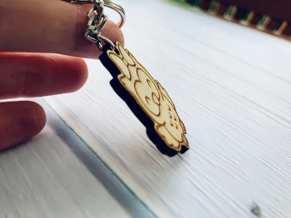 Beige_Clths_Wooden_Keychains_That_Are_Used