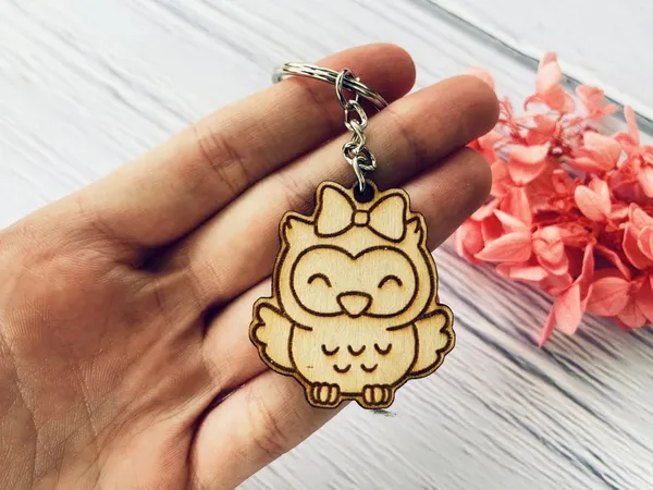 Beige_Clths_Wooden_Keychains_That_Are_Used