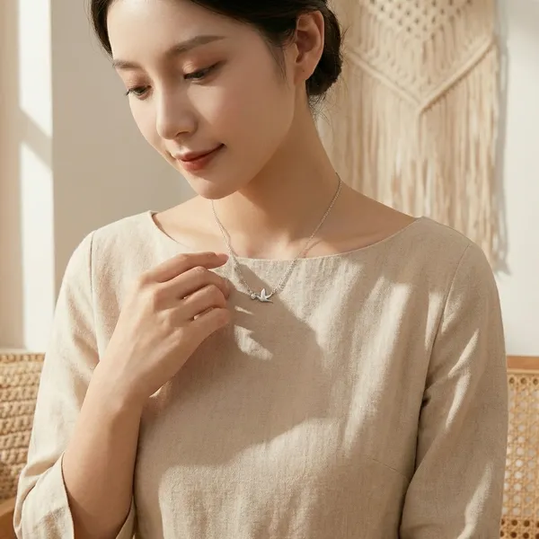 Silver-Toned_Bird_Pendant_Necklace_With_Delicate_Chain