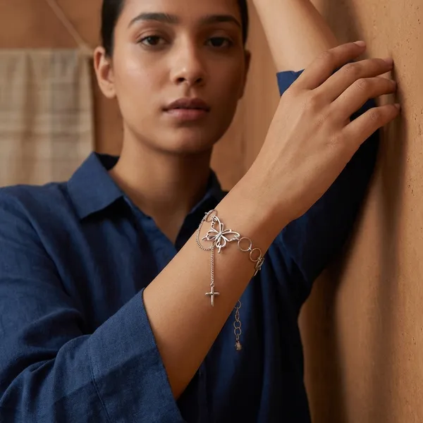Elegant_Silver-Toned_Chain_Bracelet_With_Infinity_Loop_And_Cross_Pendant