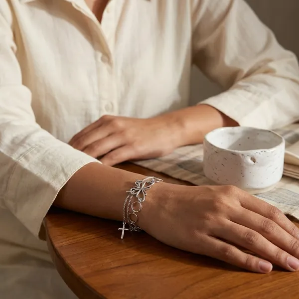 Elegant_Silver-Toned_Chain_Bracelet_With_Infinity_Loop_And_Cross_Pendant