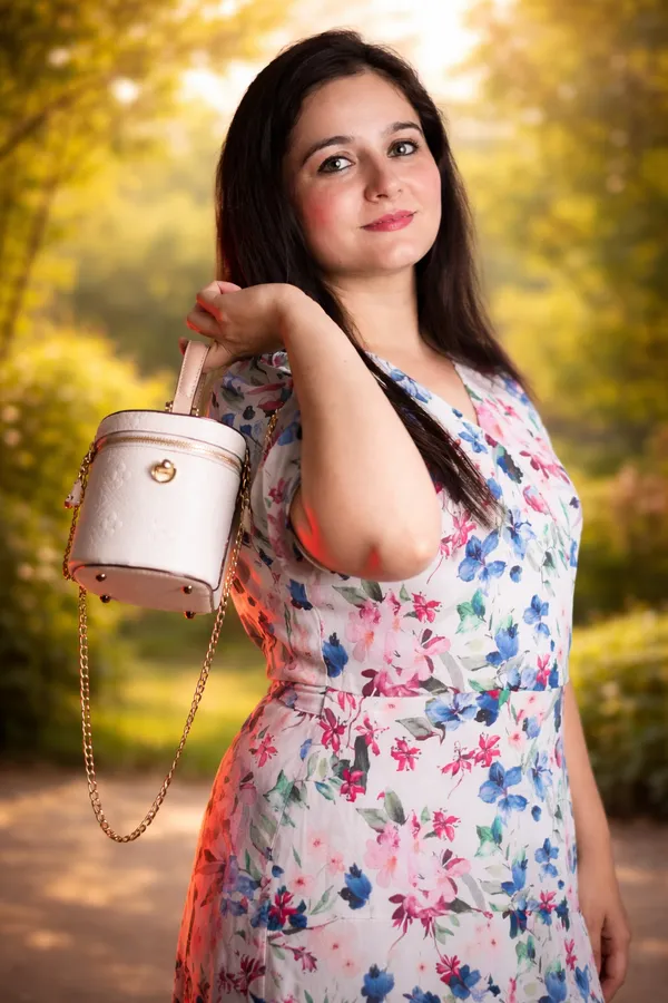 White_Cylindrical_Mini_Bucket_Bag_With_Floral_Print_Dress