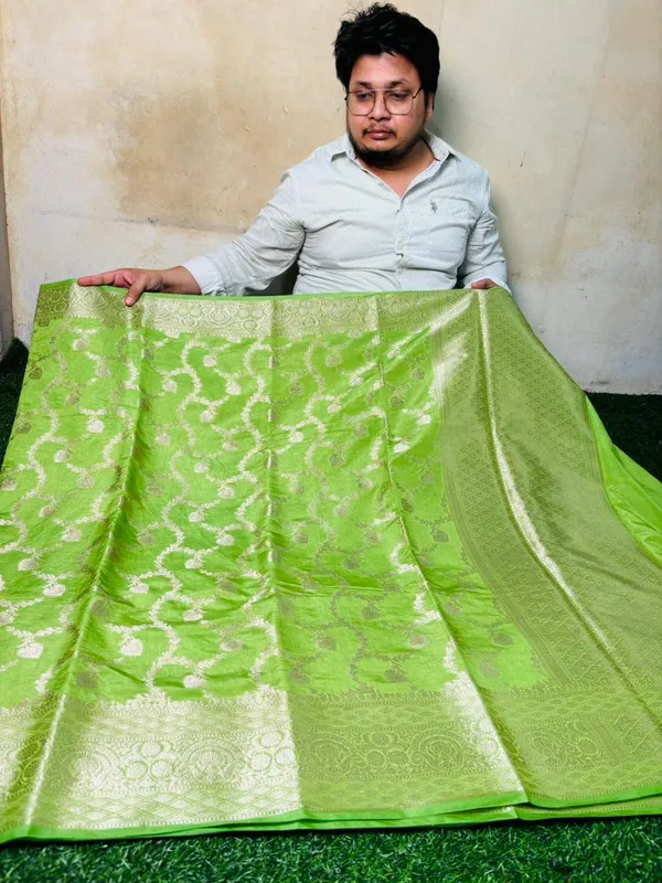 Parrot_Green_Chinia_Silk_Saree_With_Silver_Zari_Weaving_And_Traditional_Floral_Jal_Work