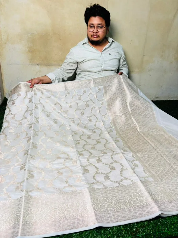 Off_White_Chinia_Silk_Saree_With_Silver_Zari_Weaving_And_Traditional_Floral_Jal_Work