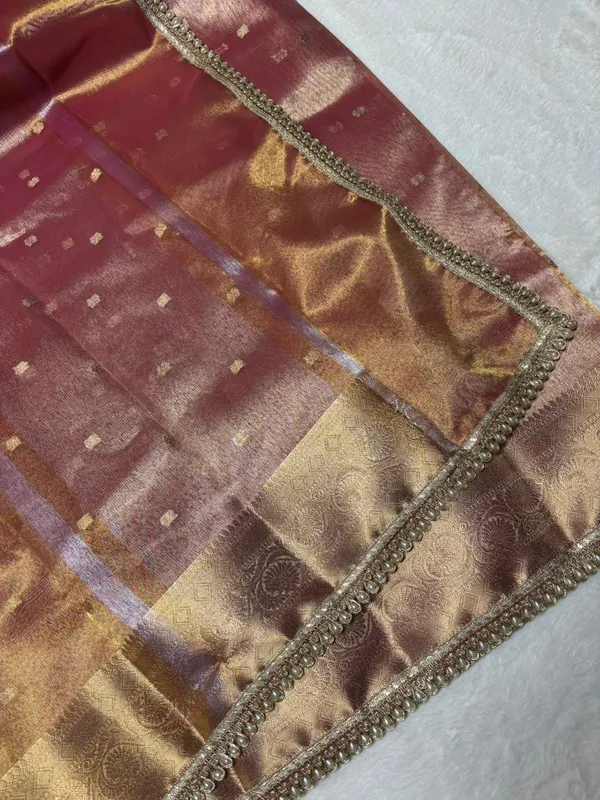 MATALLIC_PEACH_TISSUE_SILK_SAREE_WITH_HEAVY_JARKAN_LACE_WORK