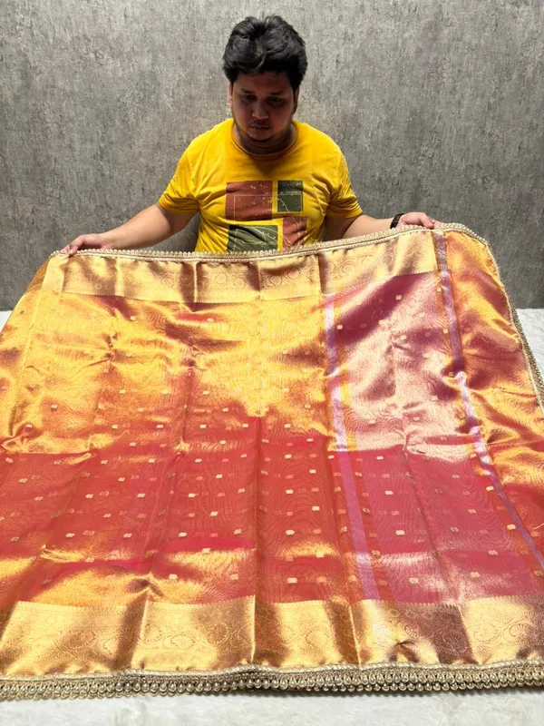 MATALLIC_PEACH_TISSUE_SILK_SAREE_WITH_HEAVY_JARKAN_LACE_WORK