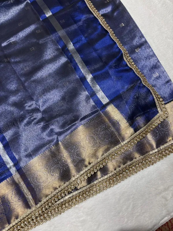 MATALLIC_ROYAL_BLUE_TISSUE_SILK_SAREE_WITH_HEAVY_JARKAN_LACE_WORK