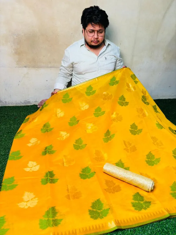 Yellow_Banarasi_Cotton_Silk_Saree_With_Green_Leaf_Motifs_And_Contrasting_Border