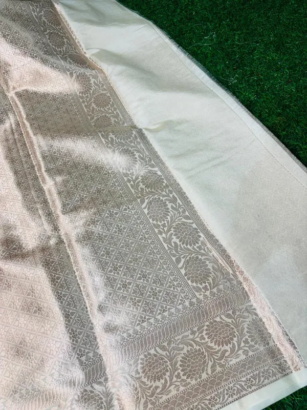 Elegant_Off_White_Silk_Saree_With_Silver_Zari_Work_And_Floral_Motifs