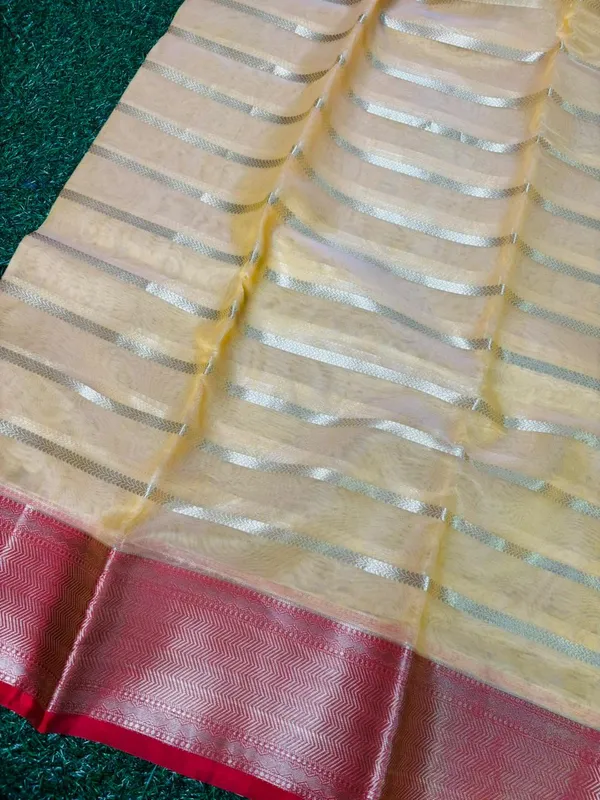 Organza_Silk_Saree_With_Golden_Zari_Stripes_And_Contrast_Red_Border