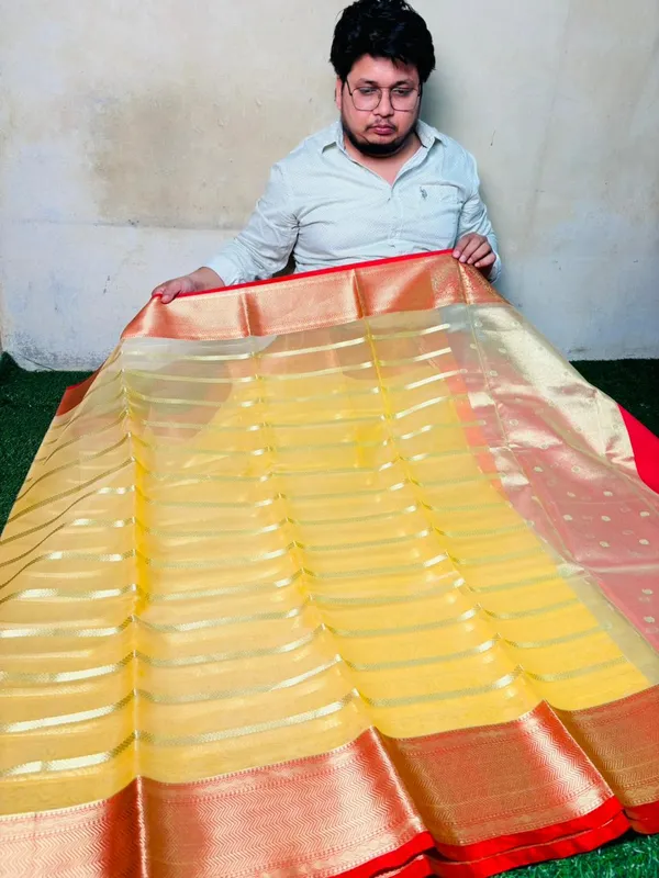 Organza_Silk_Saree_With_Golden_Zari_Stripes_And_Contrast_Red_Border