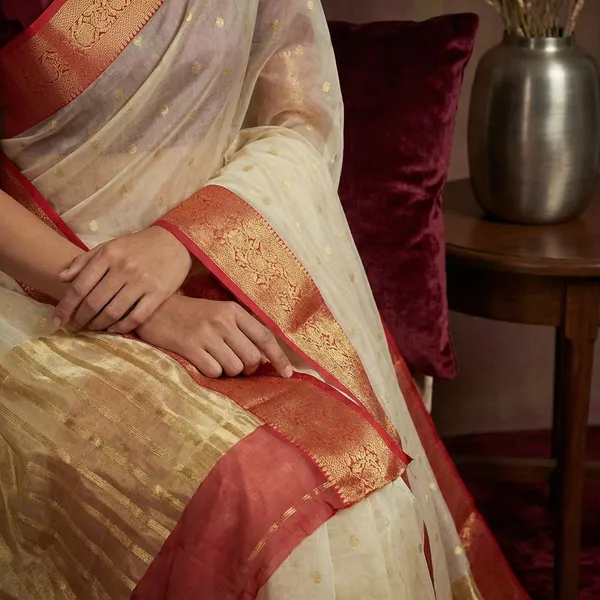 Off_White_Silk_Saree_With_Pink_Golden_Zari_Border_And_Silver_Butis