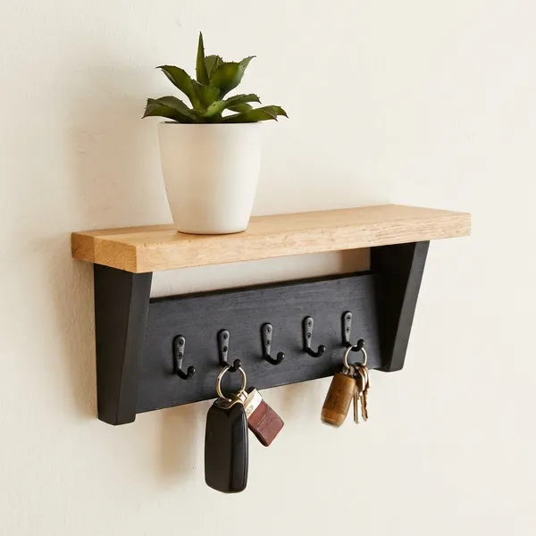 Wall_Mounted_Wooden_Shelf_With_Metal_Key_Hooks_And_Decorative_Planter