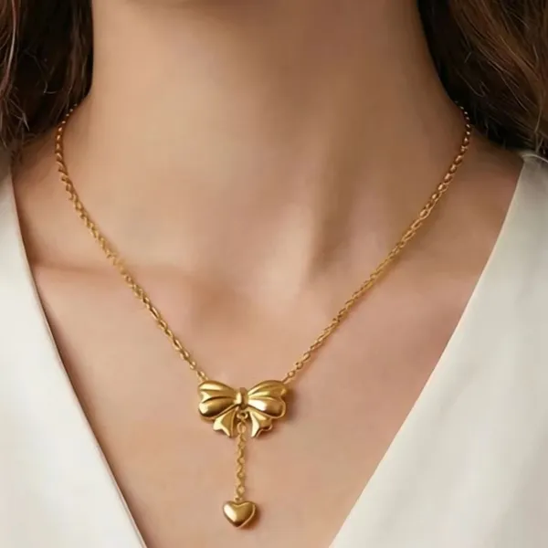 Elegant_Gold_Bow_Pendant_Necklace_with_Heart_Drop_Charm