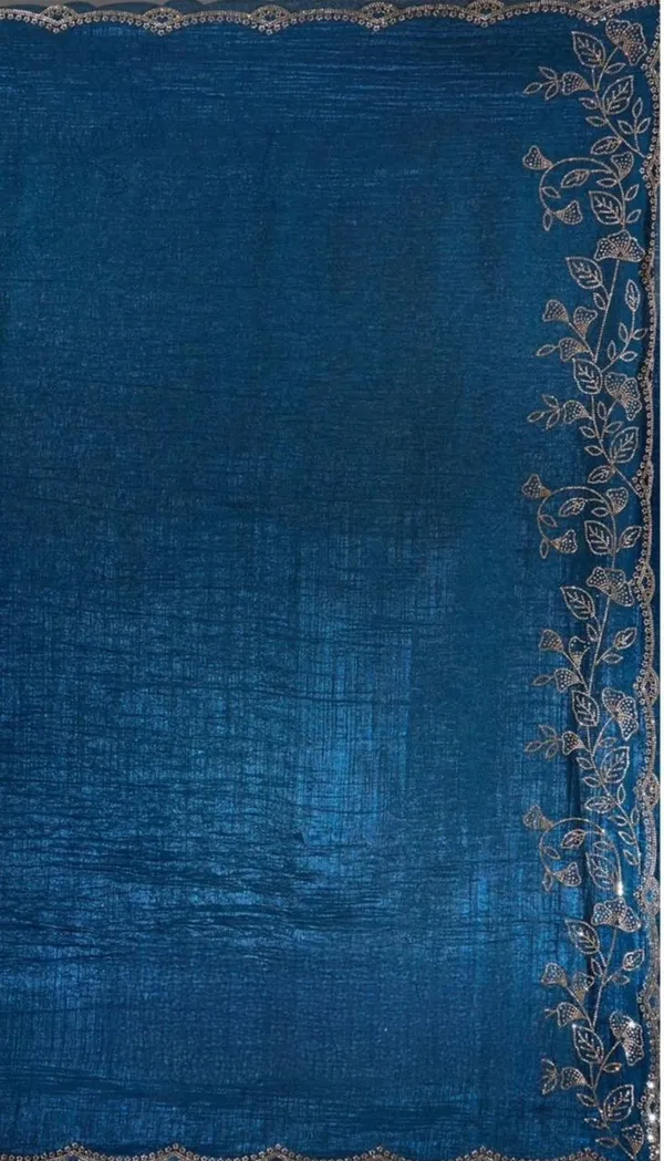 Elevate_your_ethnic_wardrobe_with_this_stunning_Navy_Blue_Designer_Saree_crafted_for_timeless_elegance._Featuring_delicate_floral_embroidery_work_on_the_border_and_pallu,_this_saree_blends_grace_with_modern_sophistication._The_rich_texture_and_shimmering_finish_add_a_luxurious_charm,_making_it_perfect_for_weddings,_festive_occasions,_parties,_and_special_celebrations._Paired_with_a_stylish_matching_blouse,_this_saree_gives_a_classy_and_graceful_look_effortlessly._