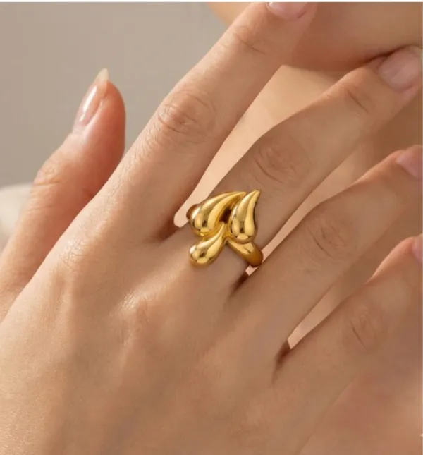 Statement_Finger_Ring_For_Women_-_Gold-Toned_Stainless_Steel_Adjustable_Ring_With_Artistic_Design