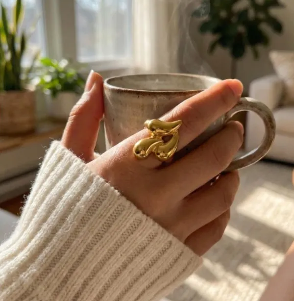 Statement_Finger_Ring_For_Women_-_Gold-Toned_Stainless_Steel_Adjustable_Ring_With_Artistic_Design